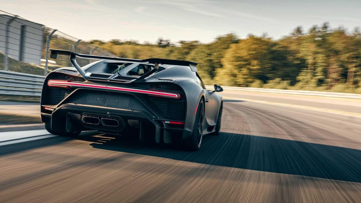 Why do sports cars prefer to use titanium alloy systems?